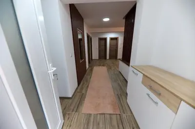 an empty hallway with a hallway leading into a room at Holiday Residence Šehić in Visoko