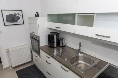 a kitchen with a sink and a microwave at Oasis in Bihać
