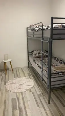 a room with two bunk beds and a rug at Apartman Dina in Sanski most