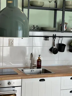 a kitchen with a sink and a counter top at Studio Mint&White Borik in Banja Luka