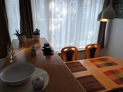 a dining room table with a bowl on top of it at Boema in Ivišovo Greblje