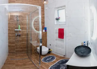 a bathroom with a shower with a toilet and a sink at Mali Wimbledon in Visoko