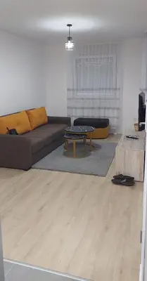 a living room with a couch and a table at Osmica Doboj in Doboj