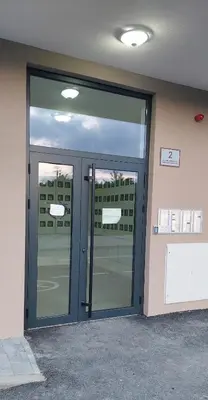 a large glass door in a building at Osmica Doboj in Doboj