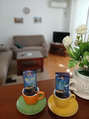 two cups of coffee sitting on a table at Apartman Borik Banja Luka in Banja Luka
