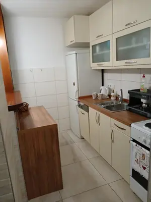 a kitchen with white cabinets and a sink at Apartman Borik Banja Luka in Banja Luka