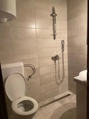 a bathroom with a shower with a toilet at Vikendica Mati in Kupres