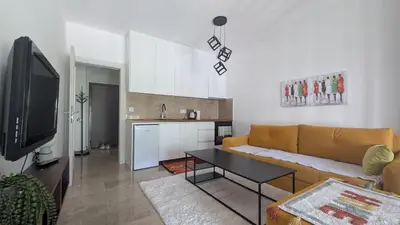 a living room with a couch and a table at Apartment SKY in Travnik