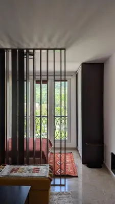 a room with a bed and a large window at Apartment SKY in Travnik