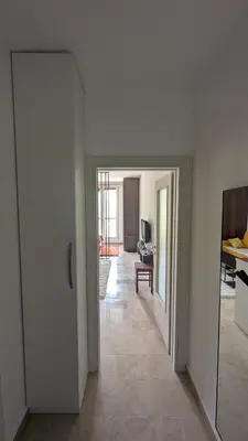 a hallway with a door leading to a living room at Apartment SKY in Travnik