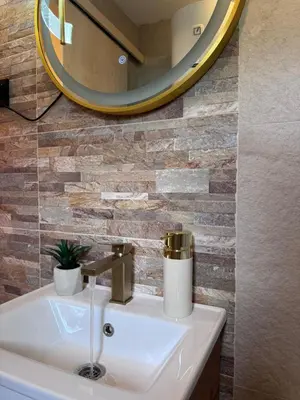 a bathroom with a sink and a mirror at Cottage Lana 2 in Jajce