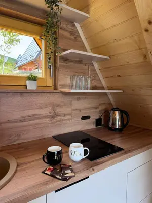 a kitchen with two coffee cups on a counter at Cottage Lana 2 in Jajce