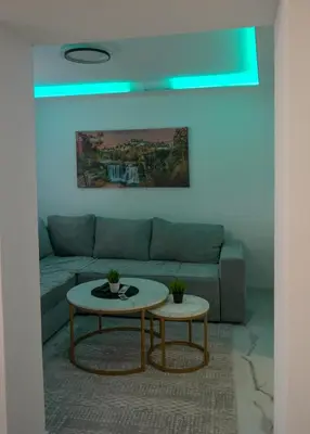 a living room with a couch and a table at Apartman Amna in Jajce