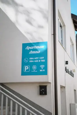 a blue sign on the side of a building at Apartman Amna in Jajce