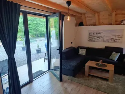 a living room with a couch and a table at Villa Tea in Šipovo