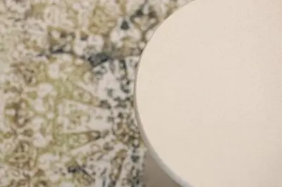 a white toilet seat in front of a wall at GRAND LUX view in Banja Luka