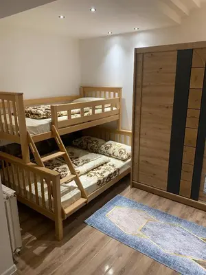 a room with two bunk beds and a sliding door at Marshal 2