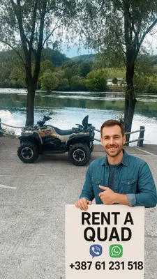 a man holding a sign in front of a parked atruck at Marshal 2