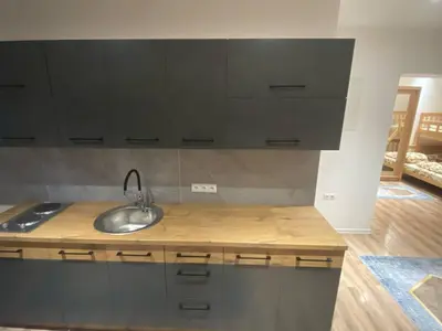 a kitchen with black cabinets and a sink at Marshal 2