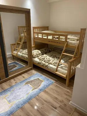 a room with three bunk beds and a mirror at Marshal 2