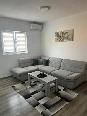 a living room with a couch and a coffee table at Apartmani Una Lux2 in Spilja