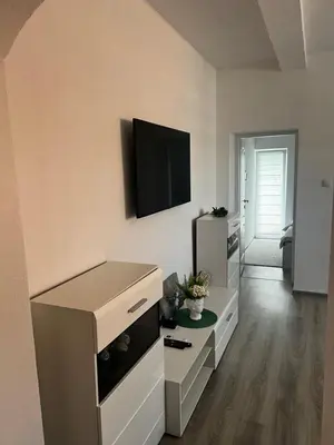 a living room with a flat screen tv on the wall at Apartmani Una Lux2 in Spilja