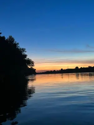 a view of a river at sunset at Apartmani Una Lux2 in Spilja