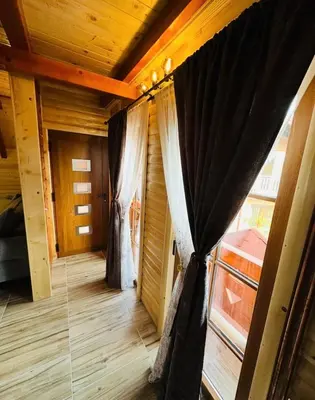 a room with a window with a curtain at Planinska kuća Jelka in Mlinište