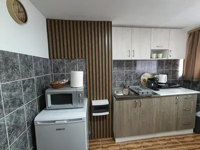 a kitchen with a small refrigerator and a microwave at Apartman 4A in Bihać