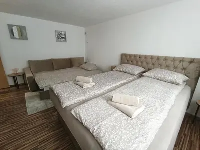 two beds with pillows on them in a room at Apartman 4A in Bihać