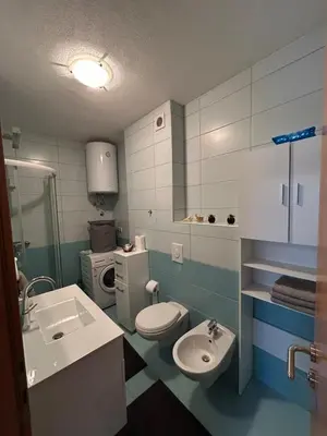 a bathroom with a toilet and a sink at Apartman Murtić in Bihać