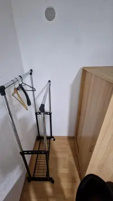 a ladder in the corner of a room with a wall at Apartman A-D in Bihać
