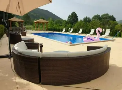 a swimming pool with a pink flamingo in the middle at Arena 2 in Ripač