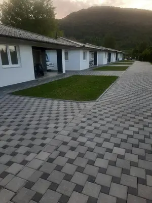 a brick driveway in front of a building at Arena 2 in Ripač