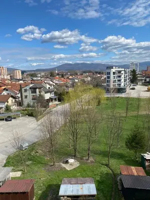 a view of a city with a park and buildings at Apartman Fad in Bihać