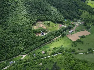 an aerial view of a park in the middle of a forest at Home of Peace at the top of the Pyramid Sun and Love in Visoko