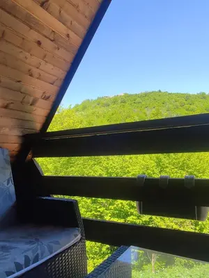 a view from the inside of a cabin with a window at Home of Peace at the top of the Pyramid Sun and Love in Visoko