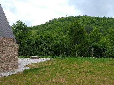 a view of a mountain from a house with a field at Home of Peace at the top of the Pyramid Sun and Love in Visoko
