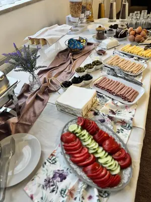 a table with a bunch of food on it at Prenoćište Stanica in Bosanska Krupa