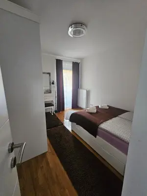 a hotel room with a bed and a window at Apartment STELLA in Bihać