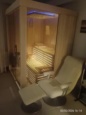 a hospital room with a white chair and a window at Luxury Apartment Saya in Banja Luka