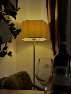 a lamp with a wine glass and a bottle of wine at Apartment Rosa Brandis in Travnik