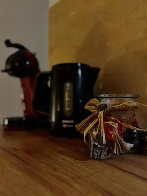 a coffee cup and a jar on a table at Apartment Rosa Brandis in Travnik