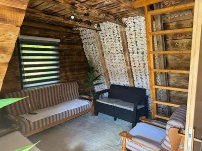 a living room with a couch and a chair at AM Pyramid resting in Visoko