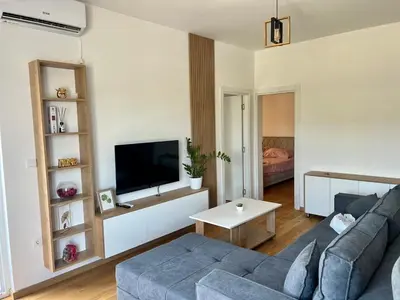 a living room with a couch and a tv at Prima in Bosanska Dubica