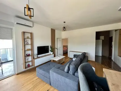 a living room with a couch and a tv at Prima in Bosanska Dubica
