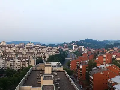a view of a city with buildings and a street at CityComfort Tuzla in Tuzla