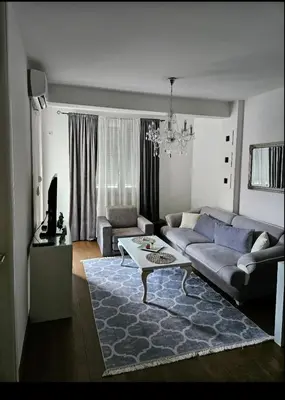 a living room with a couch and a table at Comfort pored Klinickog Centra in Banja Luka
