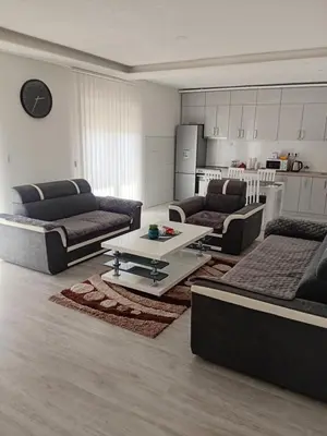a living room with two couches and a table at Apartman Volijak 44 in Jajce