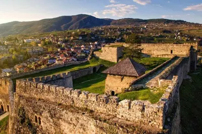 an aerial view of a castle with a city at Apartman Volijak 44 in Jajce